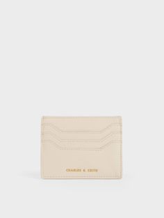 Keep things minimal with this sleek card holder. Made in a polished cream hue that is as versatile as it is stylish, this card holder keeps your important cards and curios within reach. A top zip closure also offers space for coins and cash. Slip this handy staple into your back pocket for quick coffee runs, or include in your daily bag rotation as a fuss-free alternative to a wallet. Cream Rectangular Wallets With Card Slots, Modern Beige Wallet With Interior Card Slots, Classic Beige Card Holder For Everyday Use, Everyday Beige Card Holder With Interior Slots, Chic Cream Wallet With Card Slots, Quick Coffee, Daily Bag, Charles Keith, Arm Candy