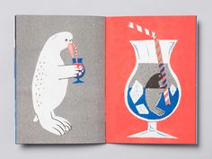 an open book with drawings of animals and drinks on it's cover, sitting on top of a table