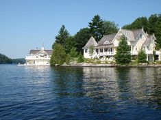 a large house sitting on top of a lake