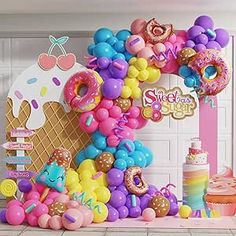 an ice cream themed birthday party with balloon decorations and balloons in the shape of numbers