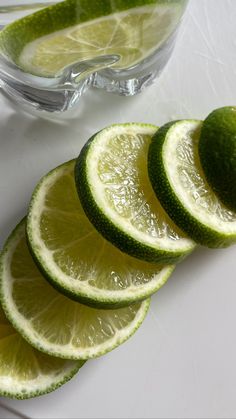 sliced limes are arranged on a cutting board