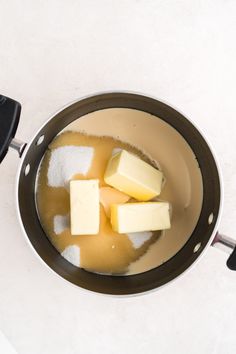 cubes of butter in a saucepan on a counter