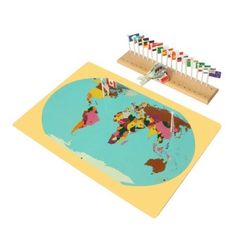 a world map with pins and markers on the top, in front of a white background