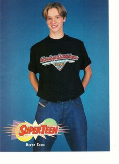 a young man is standing in front of a blue background with the words super teen written on it