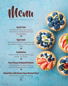 a menu with blueberries, strawberries and cream in it on a blue background