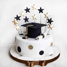 a graduation cake with stars on top