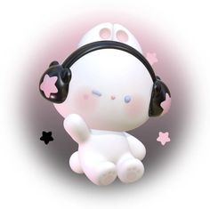 a little white teddy bear with headphones on