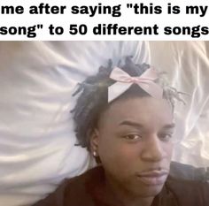 a woman laying on top of a bed next to a white sheet with the words me after saying this is my song to 50 different songs