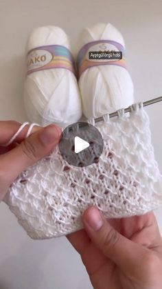 someone is crocheting the lace on their shoes with yarn and scissors to make them look like they are holding something