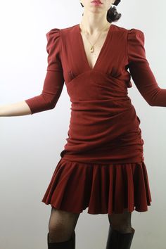 Carven 2000s burgundy wool draped dress with a breathless, beautiful back, puffed sleeves and deep neckline. A small thread pulled hidden between the pleats. Size 38 ita, 6 uk. Very good conditions. Shipping of this item takes one week for dry cleaning. I wish the dress is perfect for you! All items are vintage and used. However they are all in good to excellent condition. Any defect is specified. Sometimes, small signs of use are to be considered normal. No exchanges and returns, but ask me eve Ruched Puff Sleeve V-neck Evening Dress, Evening Ruched V-neck Puff Sleeve Dress, Evening Puff Sleeve Ruched V-neck Dress, Evening V-neck Ruched Puff Sleeve Dress, Red Fitted Puff Sleeve Dress For Fall, Fitted Brown Puff Sleeve Dress For Fall, Ruched Puff Sleeve Dress For Date Night In Fall, Fall Ruched Puff Sleeve Dress With V-neck, Fall Ruched Puff Sleeve Dress For Date Night