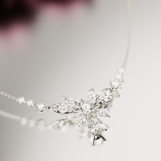 Introducing Blossom: Crafted as a romantic high-end floral necklace to complement any of our other pieces as a set or to shine brightly on it's own. This classical necklace is perfect for any occassion. As a gift for her, a supplement to an engagement ring or a gift for yourself - because you deserve it - it is guaranteed to impress. A bright and shiny string of simulated diamonds make this necklace stand out and is sure to bring lots of compliments. Each stone shines brightly to perfection and Elegant Sterling Silver Bridal Necklace With Sparkling Stones, Exquisite Sterling Silver Bridal Necklace For Party, Elegant Sterling Silver Bridal Necklace For Party, Exquisite Sterling Silver Bridal Necklace With Sparkling Stones, Elegant Sparkling Stones Jewelry Gift, Silver Cubic Zirconia Bridal Necklace Gift, Dazzling Necklaces With Sparkling Stones For Gifts, Elegant Sterling Silver Necklace For Party, Elegant Sterling Silver Necklaces For Party