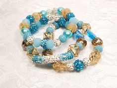 Beads of assorted sizes and shapes in shades of aqua and gold will surely glam up the day! Measurements: 7 in Gold Crystal Bracelet With Colorful Beads For Party, Gold Stretch Bracelet With Faceted Beads For Party, Turquoise Spacer Beads Jewelry For Party, Blue Beaded Festive Bracelet, Blue Beaded Bracelet For Festive Occasions, Adjustable Turquoise Crystal Bracelet For Parties, Gold Beaded Bracelets For Party With Large Beads, Elegant Turquoise Crystal Bracelet For Party, Festive Blue Beaded Bracelet