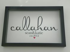 a black framed sign with the words callahn and kate written in cursive writing