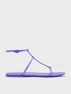 This product is made with at least 20% sustainable materials by weight. CHARLES & KEITH uses recycled, degradable, organic, and water-based materials in our eco-conscious collection. From the eye-catching purple finish to the fuss-free and lightweight construction, the recycled polyester T-bar ankle strap sandals are a summer style staple through and through. Featuring a minimalist and timeless T-bar design that will keep your feet cool in the hotter months, these shoes will take you from poolside to the streets comfortably. With adjustable ankle straps for you to find a snug and secure fit, they are made for all-day wear. This product is crafted from recycled polyester, which is obtained through re-spinning unwanted plastic items into polyester fibre. This process creates a smaller carbon Backless Sneakers, Purple Accessories, Black Gladiator Sandals, Statement Shoe, Plastic Items, Leather Espadrilles, Buckle Sandals, Charles Keith, Latest Shoes