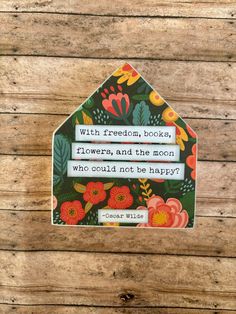 a sticker that says, with freedom books flowers and the moon who could not be happy