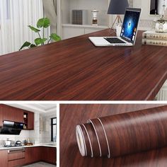 a kitchen with wooden counter tops and white walls, along with an open laptop on the counter