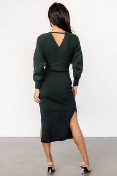 Stunning faux wrap dress Ribbed, heavyweight knit material with good stretch Deep Pine green Surplice wrap bodice and back Single band across back neck Dolman style sleeve High waist with self-tie sash Fitted skirt Slits on both side seams Self: 50% Rayon, 28% Polyester, 22% Nylon Mei Li is 5’3, cup size 32A, size 0 and wearing size S Pine Green, Good Stretches, Fitted Skirt, Faux Wrap Dress, Cup Size, Knitting Materials, Dolman Sleeve, Timeless Fashion, Wrap Dress