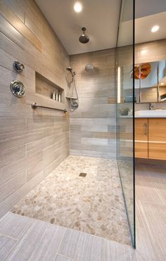 a walk in shower sitting next to a sink