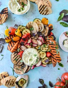 grilled vegetables and pita bread on a blue surface