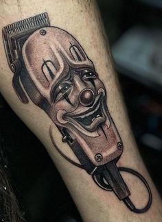 a man with a tattoo on his leg that has a hair dryer in it