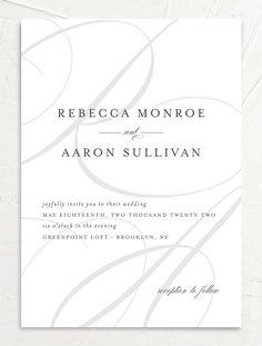 an elegant white wedding card with swirls on the front and back, in black ink