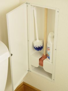 a white cabinet with two cleaning products in it