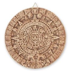 an image of a circular object made out of wood with carvings on the side and sides