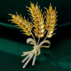 This Is Absolutely One Of The Most Beautiful Pieces Of Jewelry I Have Seen In A While! This Is A New Piece Not Vintage And Its 3" Long Approximately. The Back And Front Parts To Where The Gold Is A Very Light Gold Color. The Wheat Is A Beautiful Golden Yellow And Is Tied In A Pretty Bouquet With Tiny Paved Clear Dimond Like Crystals, Sparkles Like Real Diamonds! This Will Be Stunning For Fall, Thanksgiving Season. Give As A Gift Or Keep For You. New. Listing Vintage And New Jewelry Daily, Bundle Elegant Yellow Flower Brooches, Elegant Yellow Brooches For Gifts, Elegant Yellow Brooches For Party, Elegant Yellow Party Brooch, Elegant Yellow Party Brooches, Gold Brooches For Spring Gift, Wheat Stalk, Crystal Bouquet, Prettiest Bouquet