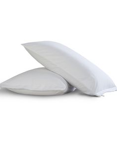 two white pillows sitting on top of each other