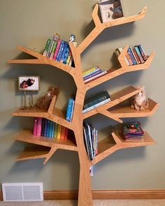 a tree shaped shelf with books on it