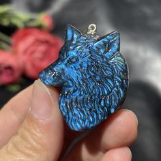 Full Flash Hand Carved Labradorite Wolf, Super Flashy Blue Labradorite Crystal. Labradorite is a stunning gemstone that is known for its remarkable iridescent play of colors, often referred to as labradorescence. Labradorite typically exhibits a gray to black base color, but when light strikes its surface, it reveals a vibrant display of spectral colors. The labradorescence effect is caused by the interference of light as it interacts with the layered structure and tiny inclusions within the sto Interference Of Light, Mystical Blue Labradorite Jewelry, Crystal Labradorite, Labradorite Crystal, Blue Labradorite, Labradorite Pendant, Surprise Gifts, Blue And Silver, Base Colour