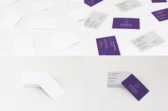 various business cards and envelopes laid out on the floor, including one with a purple logo