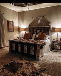 a large bed in a bedroom next to two lamps