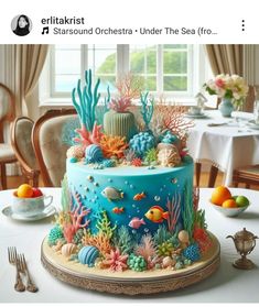 there is a blue cake decorated with corals and fish