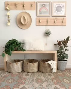 a shelf with baskets and plants on it