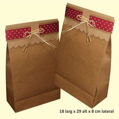 two brown paper bags with red polka dots on them