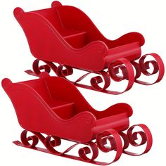 two red plastic sleighs sitting side by side on a white background,