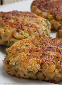 three crab cakes on a white plate ready to be eaten