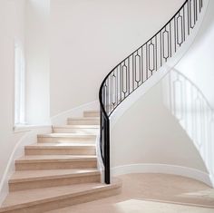 there is a stair case in the middle of this room with no people on it