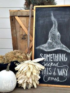 a chalkboard sign sitting on top of a wooden table next to two stuffed animals