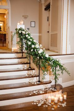 wedding flowers and candles on the stairs