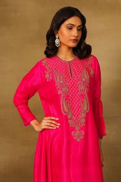 Fuchsia asymmetric tunic with paisley embroidery using dabka, bullion, coins and thread work. - Aza Fashions Elegant Fitted Tunic For Festive Occasions, Elegant Embroidered Fitted Tunic, Fitted Tunic With Resham Embroidery For Festive Occasions, Festive Fitted Tunic With Resham Embroidery, Eid Tunic With Zari Work, Bollywood Style Dabka Work Tunic, Fitted Blouse With Dabka Work, Festive Dabka Work Tunic, Festive Tunic With Traditional Drape