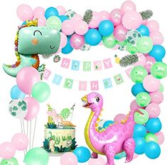 a dinosaur birthday party with balloons and decorations