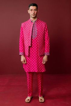 Fuchsia kurta highlighted with thread embroidered floral motifs on a butti pattern base. Comes with pant. - Aza Fashions Pink Bandhgala With Resham Embroidery For Eid, Pink Chanderi Sherwani With Zari Work, Pink Chanderi Sherwani With Resham Embroidery, Pink Bandhgala With Zari Work For Eid, Unstitched Pink Bollywood Bandhgala, Pink Bandhgala With Chikankari Embroidery For Eid, Pink Bandhgala With Chikankari Embroidery For Festive Occasions, Traditional Pink Bandhgala For Designer Wear, Pink Traditional Bandhgala For Designer Wear