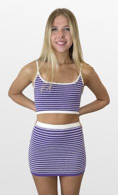 Have all eyes on you in this set! The two piece set has a cropped top with spaghetti straps and the perfect amount of stretch for an awesome fit. The matching mini skirt has a white contrast waistband for an added look. Be extra comfortable and stand out on gameday! Color- Purple and White 100% Polyester Striped Set, Red Green Yellow, Black Party, All Eyes, Purple And White, Romper Pants, Short Rompers, Two Piece Set, All About Eyes