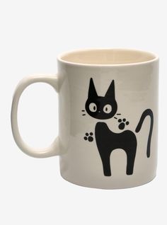 a white coffee mug with a black cat on it