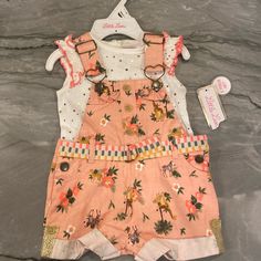 Size: 6/9 Months Color: White, Pink Condition: Never Worn Nwt Little Lass Overall And T-Shirt Set. The Overalls Do Have Snaps On The Bottom For Easy Diaper Changes. Never Worn. Comes From A Pet/Free, Smoke-Free Home! Make An Offer Or Bundle To Save! Casual Floral Print Playtime Sets, Casual Floral Print Sets For Playtime, Month Colors, Girl Baby, Matching Sets, Pink White, Overalls, Kids Shop, Color White