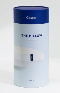 a white and blue canister with the words the pillow on it's side