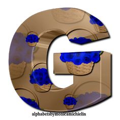 the letter g is decorated with blue flowers