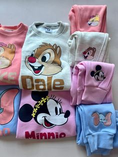 Get ready for cozy and cute with our Disney Character Sweat Set! This two-piece set will keep you warm, thanks to its fleece lining. The top features a playful graphic, while the bottoms showcase an embroidered design. Perfect for lounging or showing off your love for Disney. (Plus, it's perfect for your next Disney marathon!) Grab yours now! *DISNEY ITEMS ARE FINAL SALE Family Disney Shirts Matching, Up Disney, Disney Marathon, Graphic Sweatpants, Disney Items, Disney Clothes, Family Shirts Matching, Sweat Set, Disney Character